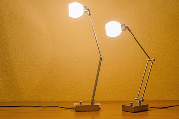 one lit lamp following another