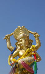 Hindu God Gannesa  glod blue sky background