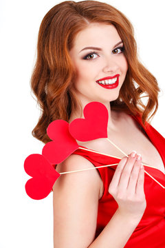 Beautiful girl in a Valentine's Day with a heart on a stick.