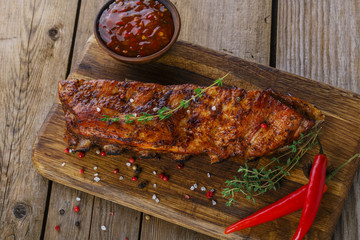 baked pork ribs on the board