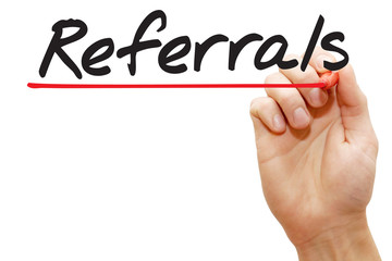 Hand writing Referrals with red marker, business concept