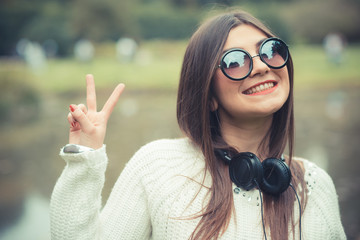 young beautiful brunette woman girl listening music headphones