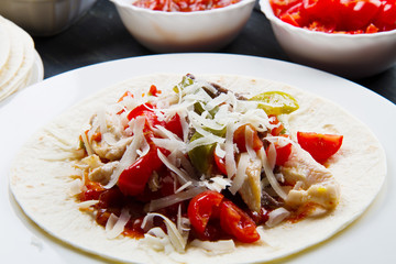 Beef and chicken  Fajitas with colorful bell peppers in  tortill