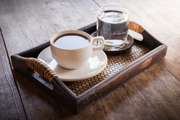 Cup of coffee on a wooden table