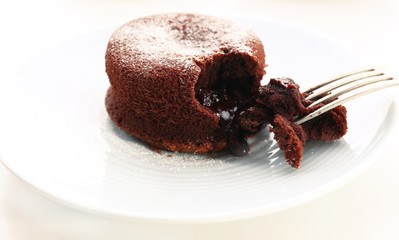 Hot chocolate pudding with fondant centre on plate, close-up