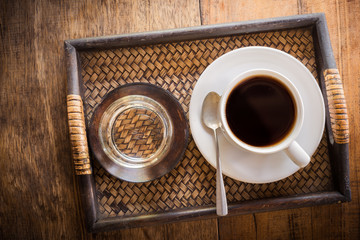 Cup of coffee on a wooden table