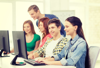female student with classmates in computer class