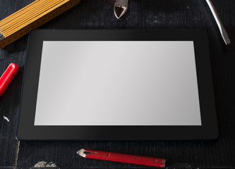 Tablet With Blank Screen Surrounded By Tools