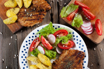 Grilled meat with salad.