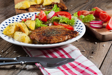 Grilled meat with salad.