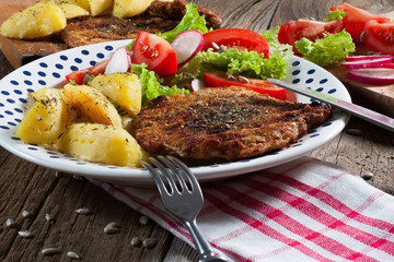 Grilled meat with salad.