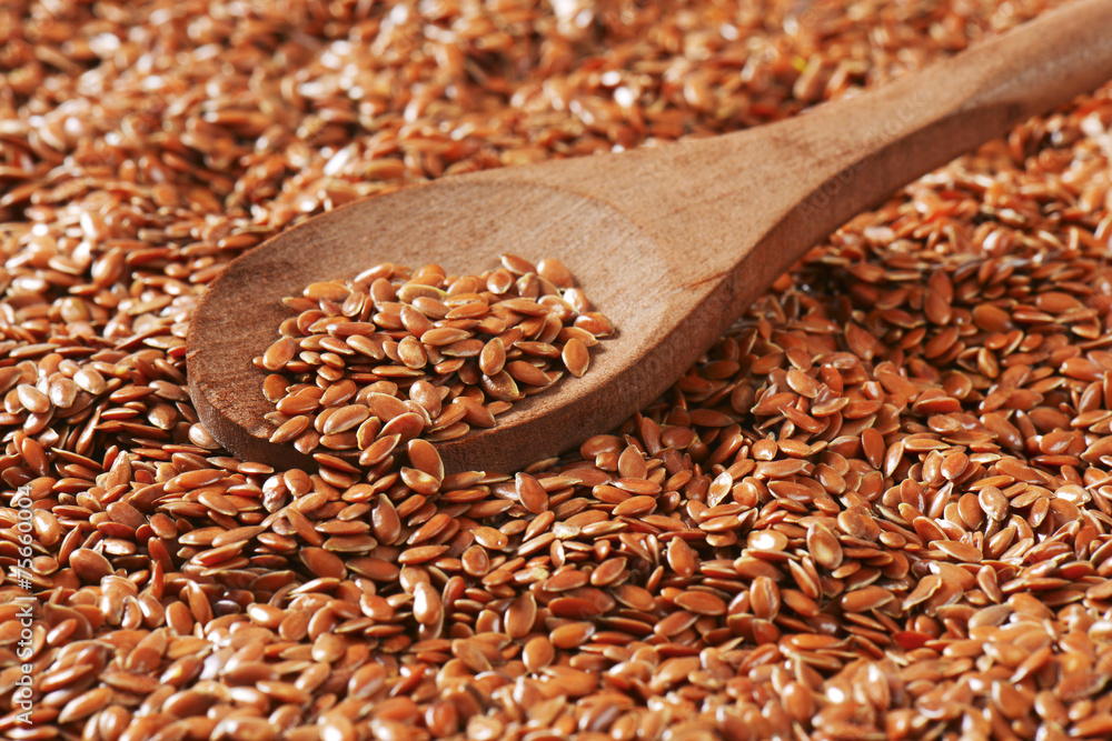 Wall mural brown flax seeds background