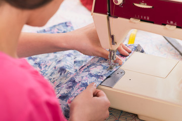 Woman sewing at home