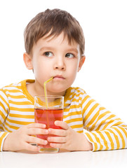 Little boy with glass of apple juice