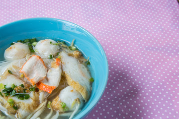 pork rice noodle soup from a bowl on table