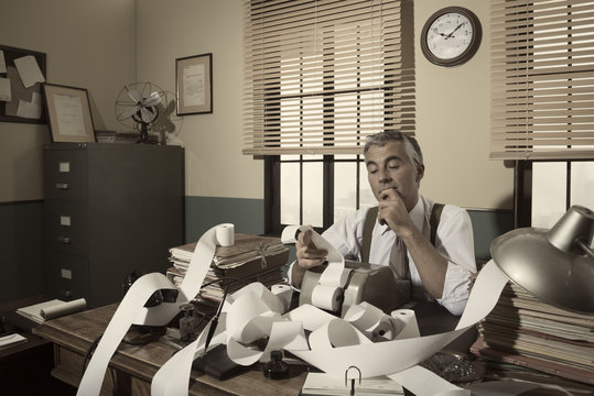 1950s accountant checking calculations