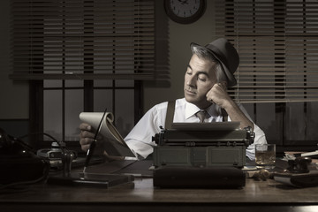 Professional reporter working late at night