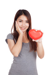 Young Asian woman happy with red heart