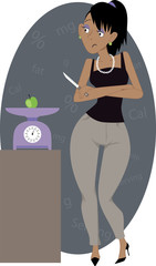 Crash diet. Woman weighing a small apple