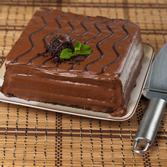 A chocolate fudge layer cake. Selective focus.