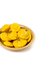 Pickled Pattypan Squash on white background. Selective focus.