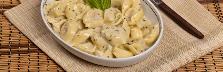 Creamy Tortellini Alfredo. Selective focus.
