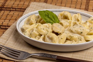 Creamy Tortellini Alfredo. Selective focus.