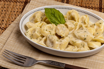 Creamy Tortellini Alfredo. Selective focus.