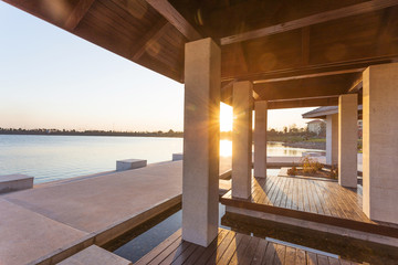 resort lakeside pavilion at sunset