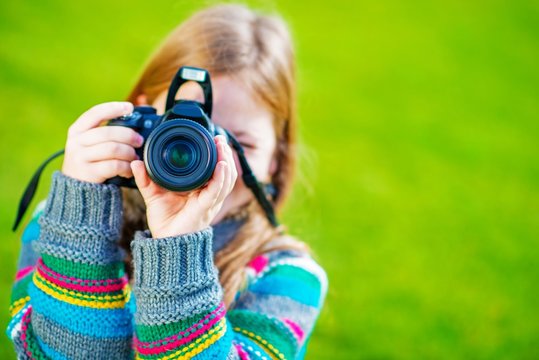 Girl Taking Pictures by DSLR
