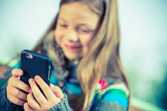 Teenage Playing Smartphone