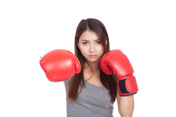 Young Asian woman with red boxing glove