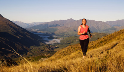 Naklejka na ściany i meble Woman Jogging In A Beautiful Mountain Scenic