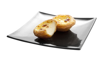 Egg tarts on black plate