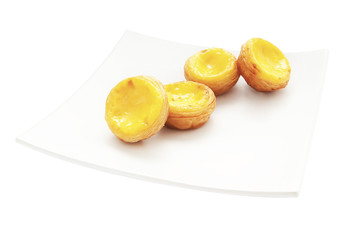 Egg tart on plate isolated on white