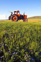 Side View Of A Tractor In A Scenic View