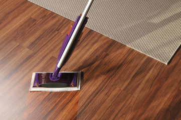 Modern mop for cleaning wooden floor from dust