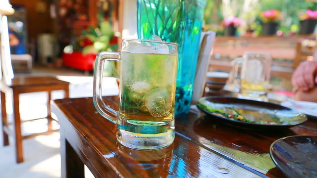 Pouring beer in big glass