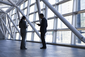 Businessmen have a stand talking