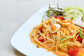 Close up of green papaya salad with salted egg