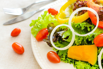 Close up of fresh salad on sackcloth