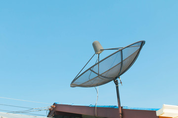 Satellite dish with sky on roof
