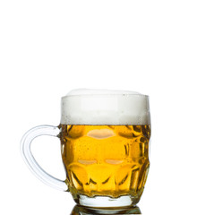 Mug full of fresh beer isolated on white