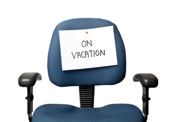 Office chair with a ON VACATION sign isolated on white