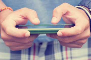 Typing messages on a smartphone.