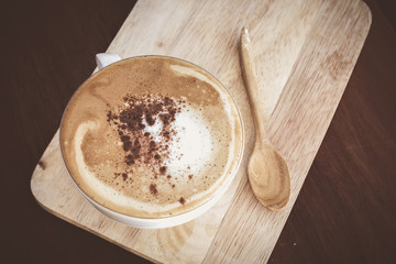 Coffee cup in coffee shop - vintage style effect picture