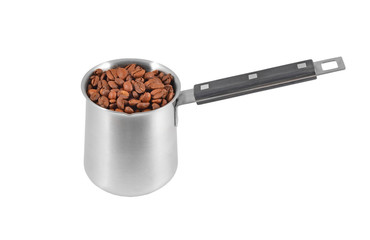 Coffee beans in steel cezve, isolated on a white background