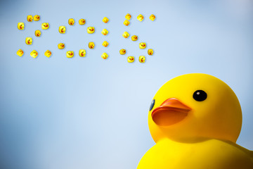 Happiness yellow rubber duck amd blue sky,happy new year 2015