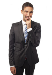 Businessman with finger in the nose