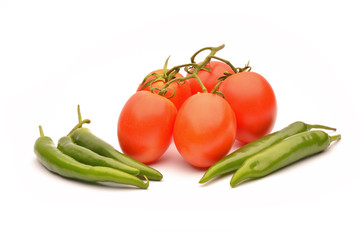 Tomatoes and hot chilli on white background